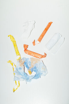 Period product tampons and plastic paper rubbish garbage on the table