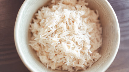 Fluffy white basmati rice steaming fresh from the pot. Perfectly cooked grains for food photography, recipe blogs, and Asian/Indian cuisine content