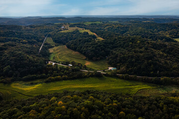 Road Winds Through Trees and Fields