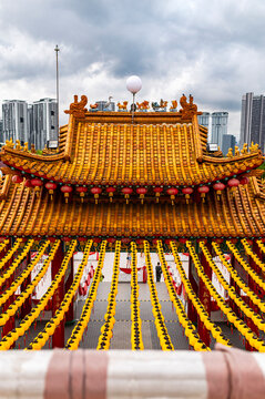 Yellow lantern rows above chinese temple courtyard