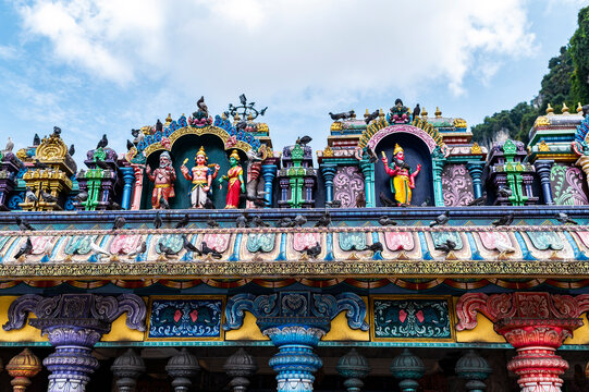 Intricate colorful sculptures on Hindu temple rooftop