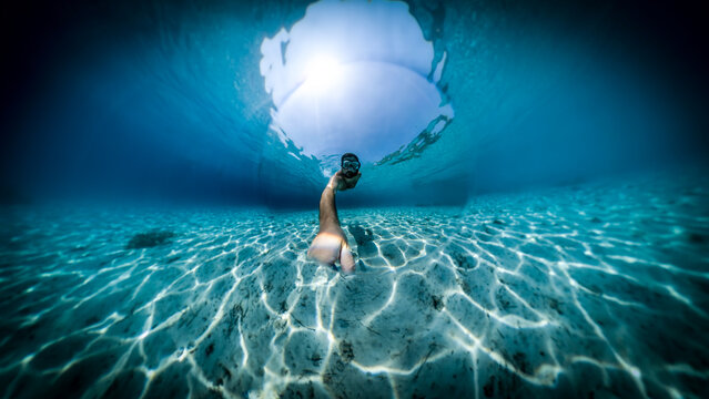 Underwater selfie at the amazing Divna beach on the Peljesac peninsula, with crystal clear water and white sand on the sea bottom