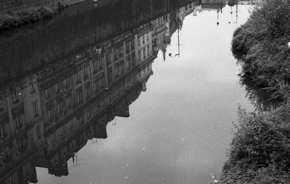 Reflections of Rennes Town in La Vilaine river
