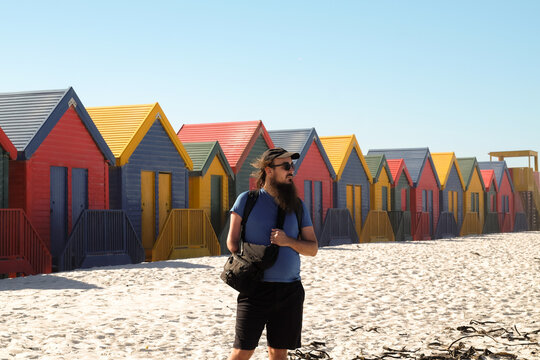 Photographer Capturing Beach Huts