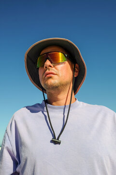 Man in Sun Hat and Sunglasses