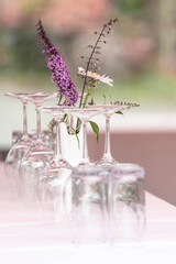 flower decoration on a table with wine glases