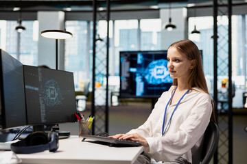 Female technician adjusting deep learning algorithms parameters at work to automate tasks. Young girl in technology company working with AI driven insights for code optimization
