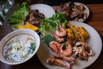 noodle soup. thick pasta soup asian cuisine seafood shrimp corn greens