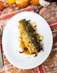 Baked mackerel fillet with caramelized onions