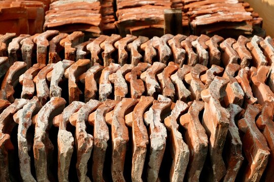 Stacked Clay Roof Tiles in Rows