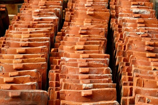 Stacked Clay Roof Tiles in Rows
