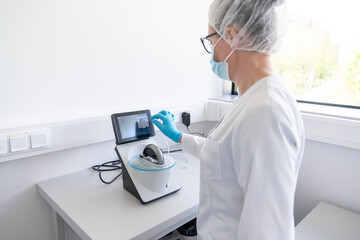 Scientist Operating Lab Extraction Device