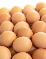 Pile of brown eggs close-up