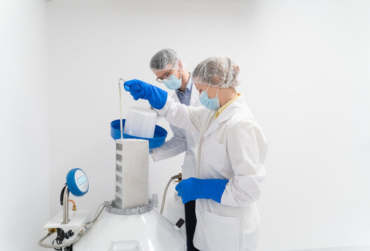 Scientists Using Liquid Nitrogen System