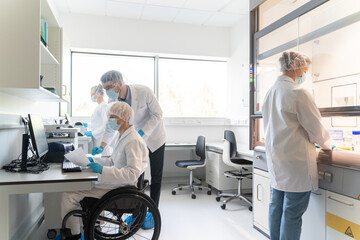 Team Collaborates on Research Project in Laboratory