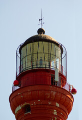 red lighthouse close-up against sky