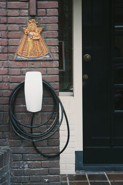 Electric Vehicle Charger at Brick Wall in Urban Setting -35mm film 