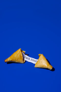 fortune cookie with the message dark times