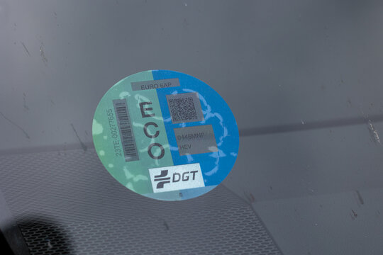 Eco sticker showing compliance with environmental regulations on car windshield