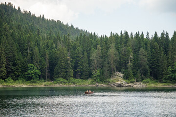 Wooden boat on Black Lake in Durmitor National Park, in Zabljak, Montenegro