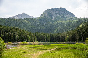 Mountains rising over Black Lake in Durmitor National Park, in Zabljak, Montenegro
