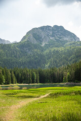 Mountains rising over Black Lake in Durmitor National Park, in Zabljak, Montenegro