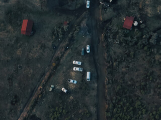 Scenic view of eco-friendly cabins nestled in the forest, blending with nature, offering sustainable lodging surrounded by lush green trees and fresh mountain air