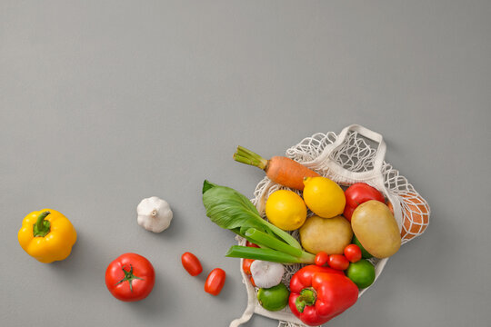 Fresh Vegetables and Fruits in an Eco-Friendly Mesh Grocery Bag