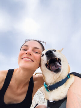 Selfie of woman with shiba inu dog