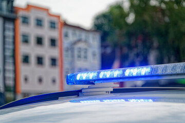 Flashing blue police light on patrol car during urban emergency alert in flensburg © Holger