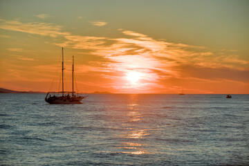Fototapeta premium big sailboat in adriatic sea with very beautiful sunset in the background near zadar croatia