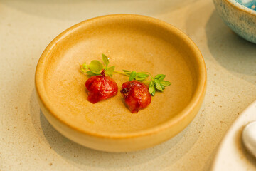 Elegant Yellow Clay Plate with Red sausage ends and Fresh Herbs