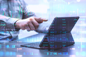 Businessman using a laptop with stock market data, trading graphs, and analytics overlay. Concept of finance and investment with cryptocurrency, online trading and market research.