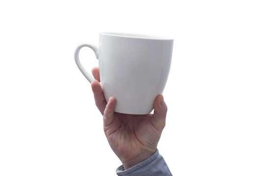 Close-up of a hand holding a mockup of a large white mug on a white background.