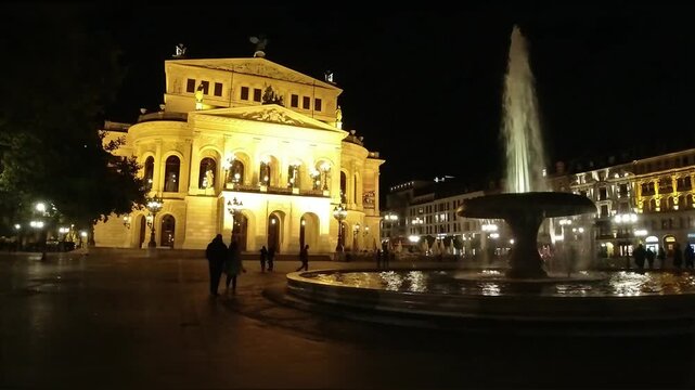 Alte Oper Frankfurt illuminated at night with fountain