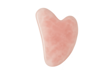 Heart-shaped pink gua sha stone for facial massage on transparent background
