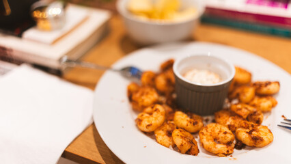 Golden fried garlic shrimp with aromatic herbs and creamy center sauce. Gourmet seafood dish perfect for restaurant menus, food blogs, and culinary photography