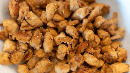 Juicy cubed chicken sautéed with garlic and minimal oil, steaming fresh. Healthy protein dish perfect for meal prep, fitness recipes, and food photography