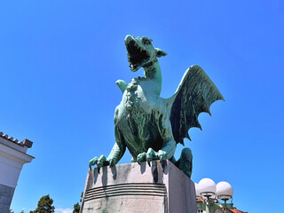 Dragon - symbol of the Slovenian capital on the Dragon Bridge in Ljubljana, Slovenia