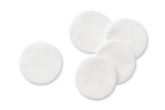 Five white cotton pads on transparent background for beauty routine