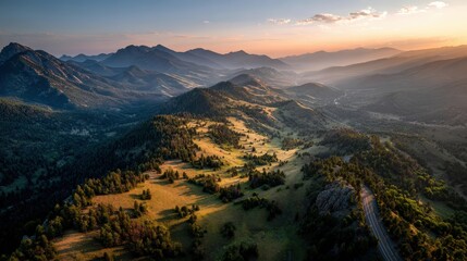 Scenic mountain valley with a train traveling through lush greenery and majestic peaks under a clear blue sky