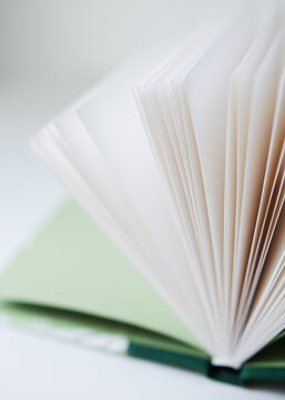 Soft focus on schoolbook with green cover