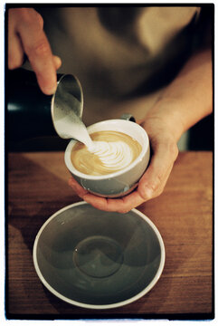 Barista making latte