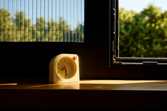 Alarm clock by the window