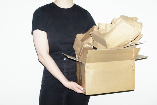 Person opening brown cardboard mail parcel package delivery boxes