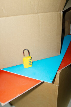 Yellow lock / padlock with code in colourful background with flashligh