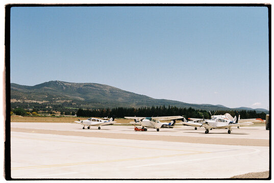 Small planes on airport apron parking.