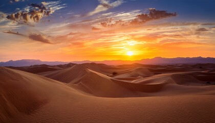 Naklejka premium breathtaking sunset over vast desert with sweeping dunes and colorful sky