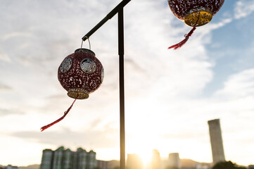 Red lantern silhouette at sunset