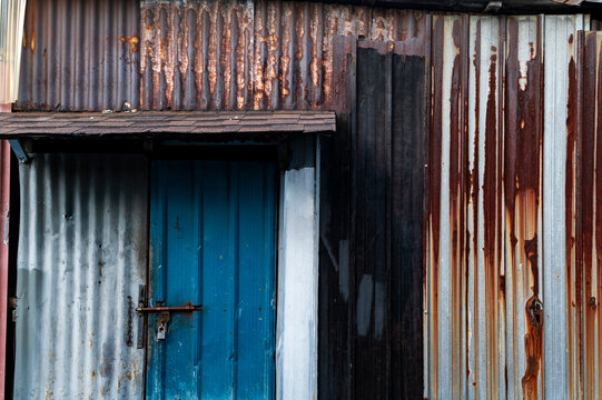 Rusty tin and blue door